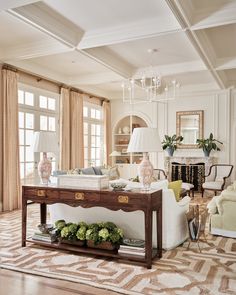 a living room filled with furniture and a chandelier