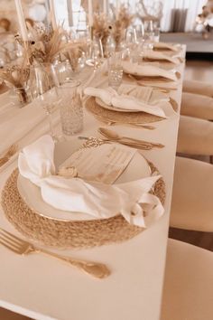 the table is set with place settings and napkins for guests to sit down at