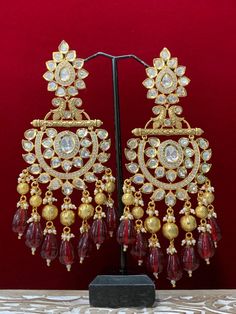 Premium quality High gold plated, pearl work, hand carved work , AD lining and kundan work. Clip back.  about 5 inch long  Absolute designer piece and statement earring. Kundan Chandbali, Kundan Work, Pearl Work, Polki Necklace, Chandbali Earrings, Kundan Earrings, Statement Earring, Maroon Red, Head Accessories