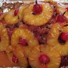 pineapples and raspberries are piled on top of each other in this dish