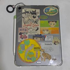 an ipad case with various stickers on it