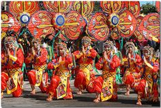 a group of people dressed in colorful costumes