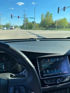 the dashboard of a car with an electronic display on it's screen and steering wheel