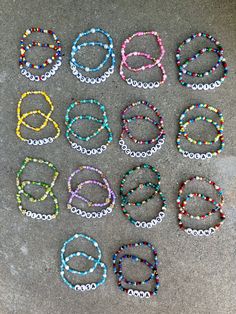 many bracelets are laid out on the ground