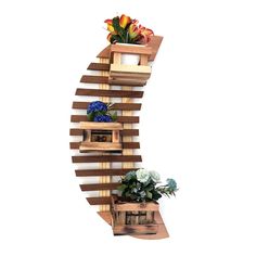 a wooden shelf with flowers on it and two planters attached to the top one