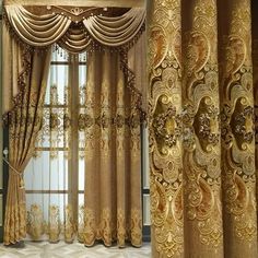 the curtains in this room are gold and have intricate designs on them, as well as draperies