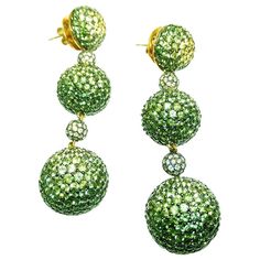 18Karat White Gold Yellow, Green Sapphire Three Ball Chandelier Earrings Graduated 3 balls earrings made in 18k Gold.We graduated the color sapphire to show the power of color in green and yellow.This earrings is detachable. So you can wear as alone one ball and wear as a long chandelier earrings for the party. Yellow and Green Sapphire 32.75 ct High quality of stones Diamond 1.38 ct H VS Quality Yellow Chandelier, Yellow Diamond Earring, Ball Chandelier, Green Diamonds, Pearl Chandelier Earrings, Diamond Chandelier Earrings, Pearl Chandelier, Gold Chandelier Earrings, Earrings Chandelier