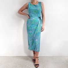 Gorgeous, vintage pure silk dress in turquoise with lilac and green floral pattern. It has a fitted shape, wrap style skirt part, a scoop neckline and long zip at the back. It is made from pure silk, that's smooth and light, and ever so soft. Top part comes lined. A beautiful, flattering dress for days out and special occasions. Made by Robbie Bee in China. 100% silk, 100% polyester lining. Labelled as size 12 PETITE. (Worn in photos by UK12, 168cm tall). Measurements when laid flat are:  Should Turquoise Silk Dress For Spring, Silk Knee-length Floral Print Dress, Fitted Sleeveless Turquoise Midi Dress, Elegant Midi-length Rayon Slip Dress, Spring Silk Wrap Dress, Maxi Length, Knee-length Silk Floral Print Dress, Chic Floral Print Silk Dress With V-neck, Pure Silk Dress, Silk Dress Long