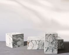 three marble blocks sitting next to each other