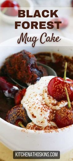 black forest mug cake in a bowl with whipped cream and cherries on the top