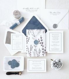 the wedding stationery is laid out and ready to be put into their guests'envelopes