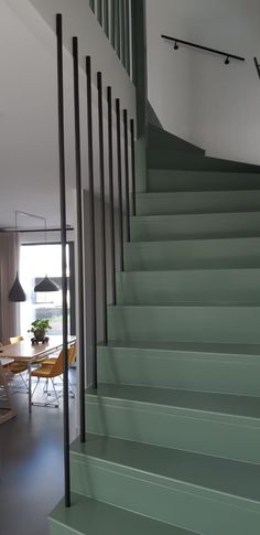 there is a green stair case in the house