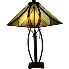 a lamp that is sitting on top of a wooden stand with a glass shade over it