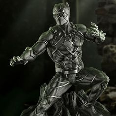 the black panther statue is displayed in front of a dark background