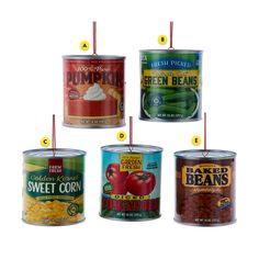 six cans of canned food are shown with labels indicating the different types of beans in them