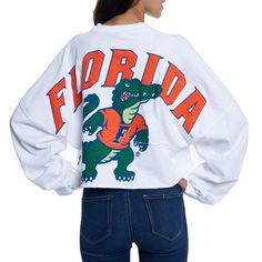 Whether you're a current student, alumni or just a superfan, every member of the Florida Gators franchise needs a solid collection of gear. This season, spruce up your look with this chic Raw Hem Cropped Spirit Jersey T-shirt! The fierce Florida Gators graphics and super-soft blend make this fun top a must-have addition to your closet!Whether you're a current student, alumni or just a superfan, every member of the Florida Gators franchise needs a solid collection of gear. This season, spruce up School Spirit Shirts Designs, School Shirt Designs, School Spirit Wear, School Spirit Shirts, Cheer Shirts, College T Shirts, Jersey Long Sleeve, Spirit Shirts, Spirit Jersey