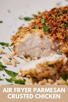 a white plate topped with meat covered in parmesan cheese and garnish