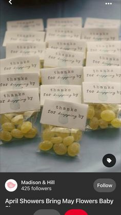 small bags filled with yellow candies sitting on top of a table