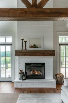 a living room with a fire place in the center and wood beams on the ceiling