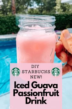 someone holding up a pink drink in front of a swimming pool with the words iced guva passionfruit drink