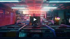 a room filled with lots of records and neon lights