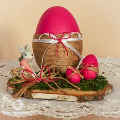 a basket with eggs and other decorations on a table