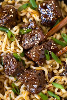 meatballs and noodles in a bowl with chopsticks