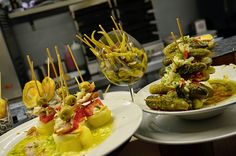 several plates filled with food sitting on top of a counter