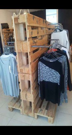 clothes on wooden pallets in a clothing store