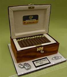 an open box of cigars sitting on top of a table