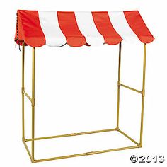 a red and white striped awning on top of a metal stand with gold legs