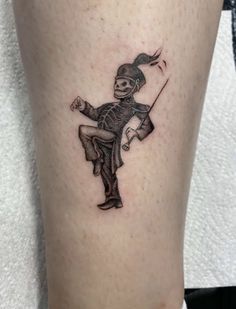 a tattoo on the leg of a person with a baseball bat