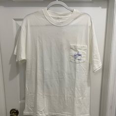 Guy Harvey Short Sleeve Tee Brand New With Tags Size: Large Color: White White Graphic Tee With Pockets, Summer Graphic Tee With Pockets, White Summer Tops With Pockets, Casual White Shirt With Pockets, Casual White Tops With Pockets, Tan Shirt For Summer Streetwear, Relaxed Fit Tan Cotton Shirt, Relaxed Fit Cotton Shirt In Tan, Tan Cotton Shirt With Relaxed Fit