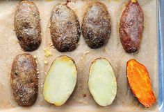 several different types of vegetables on a baking sheet with some powdered sugar over them