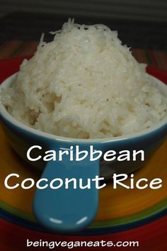 a bowl filled with coconut rice on top of a colorful plate