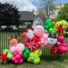 Pink, red and green organic balloon garland with a Christmas in July theme.  Custom personalized balloon and festive foil balloons. Colorful Christmas Balloon Garland, Holiday Office Decor, Christmas Balloon Garland, Candyland Party Decorations, Green Balloon Garland, Christmas Setup, Christmas In July Party, Christmas Candyland, Christmas Balloon Decorations