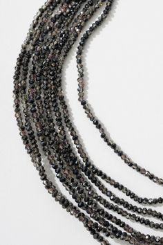 You'll reach for the Multi Strand Beaded Crystal Necklace again and again. Crafted with shimmering glass beads, this glitzy crystal necklace adds sparkle to all your favorite looks. The magnetic clasp allows for easy on and off. Material: Glass Beads Size: 18" Long Magnetic Clasp Party Crystal Necklaces With Black Round Beads, Party Black Beaded Crystal Necklace, Crystal Beaded Necklaces For Party, Crystal Beaded Necklaces For Party With Round Beads, Single Strand Crystal Beaded Necklaces For Party, Single Strand Crystal Beaded Necklace For Party, Party Crystal Beaded Necklaces With Round Beads, Party Single Strand Crystal Beaded Necklace, Multi-strand Faceted Beads Crystal Necklaces For Party