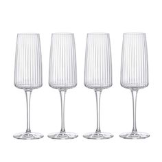 four empty wine glasses sitting next to each other