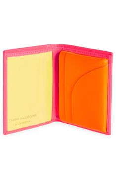 Eye-popping fluorescent hues inside and out bring can't-be missed appeal to a slim leather wallet with ample pockets and slots for your financial essentials. Interior currency pocket; two slip pockets; four card slots Leather Made in Spain SPACE: A shop for emerging and advanced designers Bifold Wallet, Cool Wallets, Yellow Wallet, Louis Vuitton Pink, Slim Leather Wallet, Cute Wallets, Keychain Wallet, Best Wallet, Leather Bifold Wallet