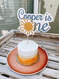 a cake on a plate with a sign that says copper is one