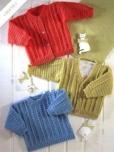 three knitted sweaters, one with buttons and the other with an open collar