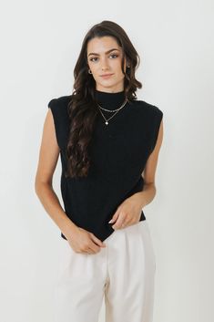 Stay stylish and comfortable all season long in the Mock Neck Sweater Vest for Women in Black! Featuring a mock neck and soft material at the touch, you need to add this to your cart for Fall! Features: Mimosa Style: MT1546-BLACK Color: Black 42% Acrylic 30% Polyester 28% Nylon Women’s Sweater Vest Sleeveless Mock neck Ribbed soft sweater vest material Measurements from a size small: Length from center back: 22” Chest: 36" hand cold wash, lay flat to dry Trendy Black Knit Turtleneck, Black Funnel Neck Sweater For Layering, Versatile Mock Neck Top For Fall Layering, Casual Black Knit Turtleneck, Fall Mock Neck Top For Layering, Winter Mock Neck Top For Layering, Winter High Neck Knit Mock Neck Top, Winter Knit Mock Neck Top, Winter Knit High Neck Mock Neck Top