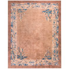 an antique rug with blue and beige accents