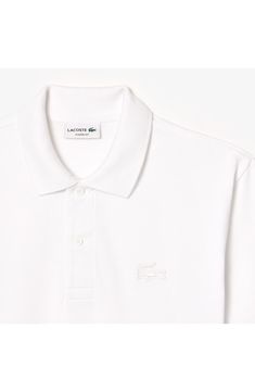 A glossy, puffed crocodile logo on the chest punctuates this comfortable but stylish polo that has side slits for easeful movement. 28" length Button half placket Spread collar Short sleeves Side slits 100% cotton Machine wash, line dry Made in Peru Elegant White Polo Shirt With Ribbed Collar, Crocodile Logo, Mens Tools, Rollerball Perfume, Walker Shoes, Favorite Daughter, Platform Slippers, Maternity Shops, Designer Clothes For Men