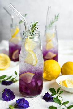 three mason jars filled with lemonade and lavender