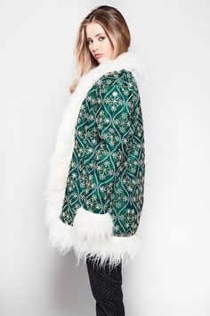 Our latest take on the afghan coat is here and it is stunning. A gorgeous dark emerald green taffeta base with embroidery in gold and white abstract floral tile detailing finished with luxurious Mongolian cream fur trim. Upgraded inner linings now in a beautiful matching green satin, still with the same fleece inside for extra warmth. Compliments guaranteed.  Now available in 3 sizes  S = 8-10 M = 10 - 12 L = 12 - 14  ⚬ Inside pocket + two front pockets ⚬ Hook and eye closure ⚬ Orange taffeta ba Luxury White Fleece-lined Outerwear, Luxury White Outerwear With Fleece Lining, Luxury Cream Fur Coat With Faux Fur Trim, Luxury Cream Faux Fur Coat, Afghan Coat, Dark Emerald Green, Floral Tile, Fur Trim Coat, Floral Tiles