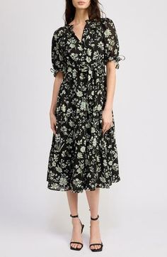 An effervescent floral pattern blossoms on a belted midi dress complete with impeccable puff sleeves. 44" length (size Medium) Front button closure Split neck Short sleeves Removable tie belt Partially lined 98% polyester, 2% spandex Hand wash, line dry Imported Spring Floral Print Mid-length Puff Sleeve Dress, Spring Mid-length Puff Sleeve Dress With Floral Print, Floral Print Midi Puff Sleeve Dress For Daywear, Floral Print Puff Sleeve Midi Dress For Daywear, Midi Puff Sleeve Floral Dress For Daywear, Spring Belted Dress With Puff Sleeves, Spring Puff Sleeve Belted Dress, Elegant Midi-length Puff Sleeve Dress With Floral Print, Belted Knee-length Midi Dress For Garden Party