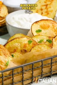 baked potato chips in a basket with dip and sour cream on the side, ready to be eaten