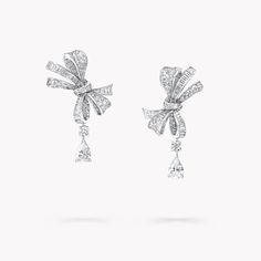 Effortlessly suspended from exquisite diamond bows with fiery round diamonds in-between, pear shape diamonds provide the perfect finishing touch to our Tilda’s Bow classic diamond drop earrings in white gold. Sensual and playful, the bows are a feat of diamond craftsmanship, pairing round diamonds with custom cut baguette cut diamonds to bring life and light to each precious curve. An evergreen motif at the House of Graff, the Tilda’s Bow collection evokes the sensual femininity of a bow, tied m Delicate Diamond Rings, Graff Diamonds, Diamond Drop Pendant, Classic Diamond Ring, Pear Shaped Diamond Ring, Diamond Drop Necklace, Diamond Bows, Fine Diamond Jewelry, Bow Jewelry