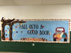 a bulletin board that says fall into a good book